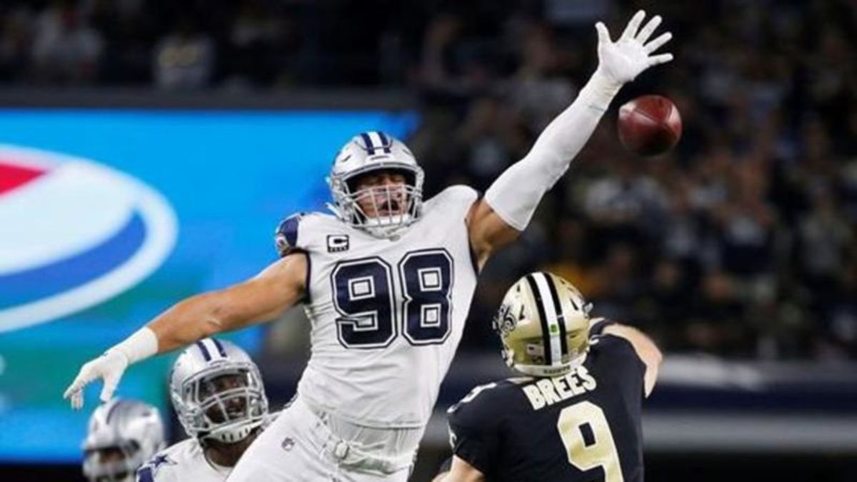 Cowboys try out long snappers after Jake McQuaide's season-ending injury