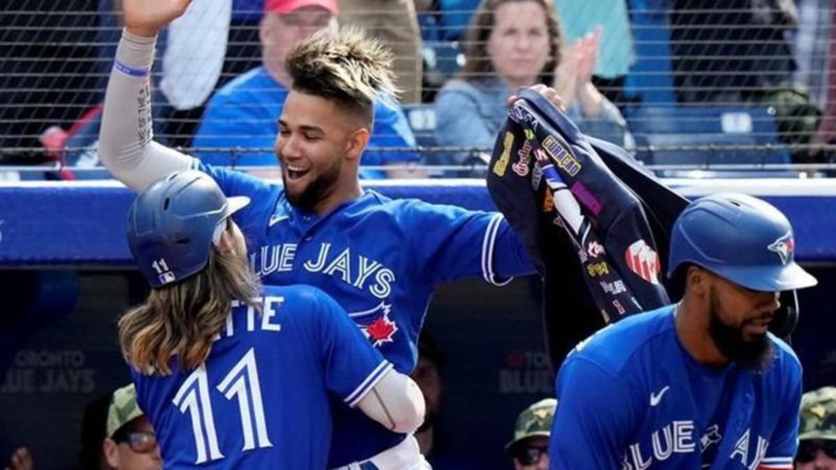 Bo Bichette of the Toronto Blue Jays smiles as he jogs off the