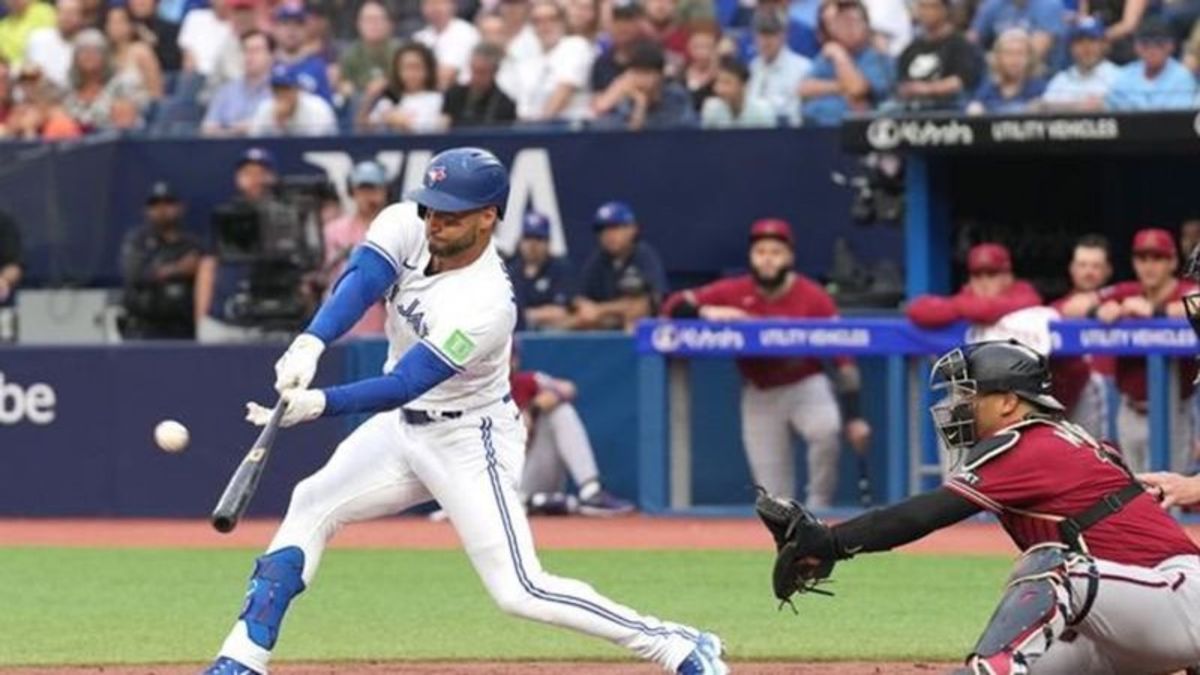 Lourdes Gurriel Jr. takes in the game from the best seat in the